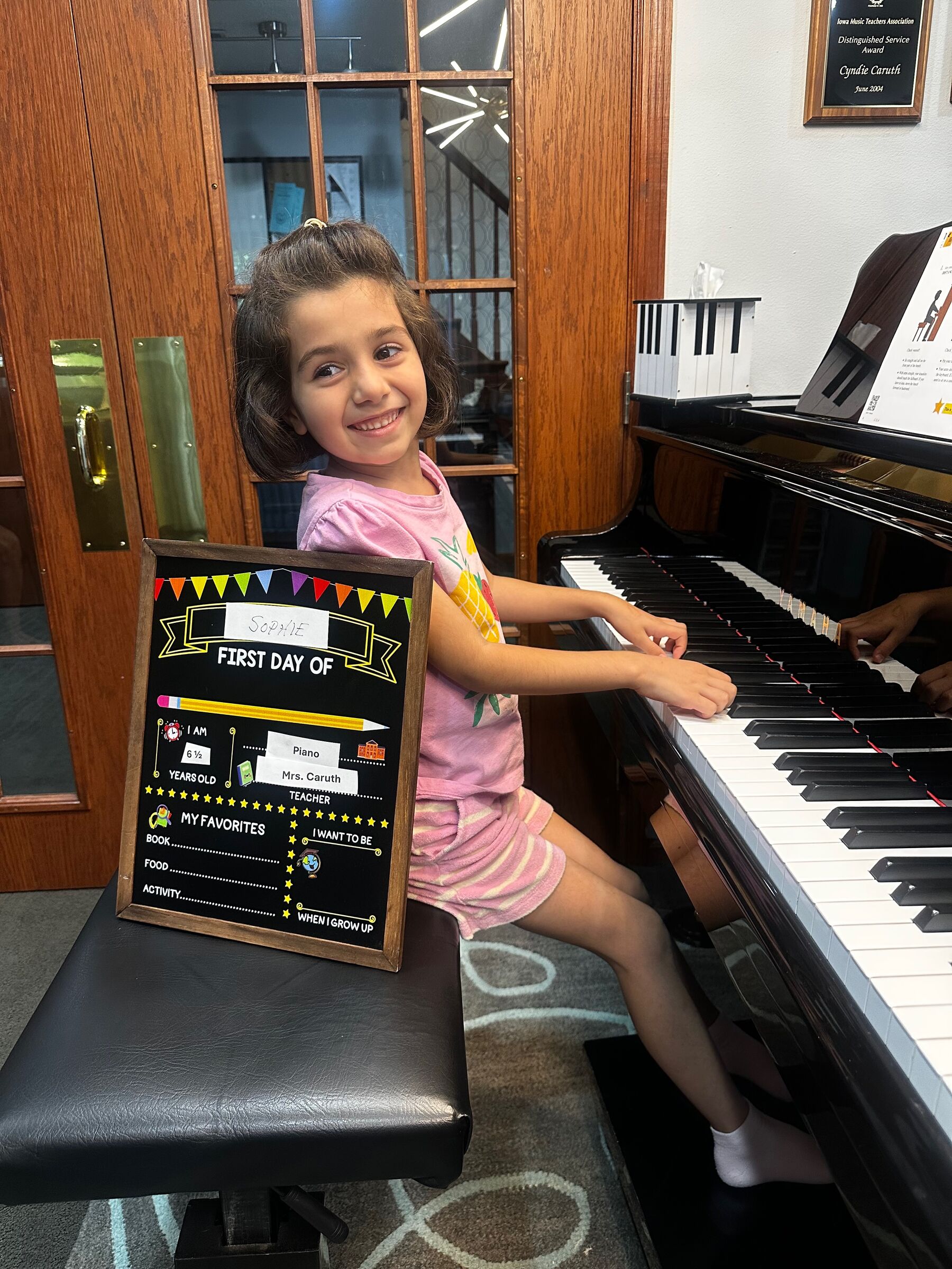 A young student at her first piano lesson at Caruth Piano Studio in Ankeny, Iowa