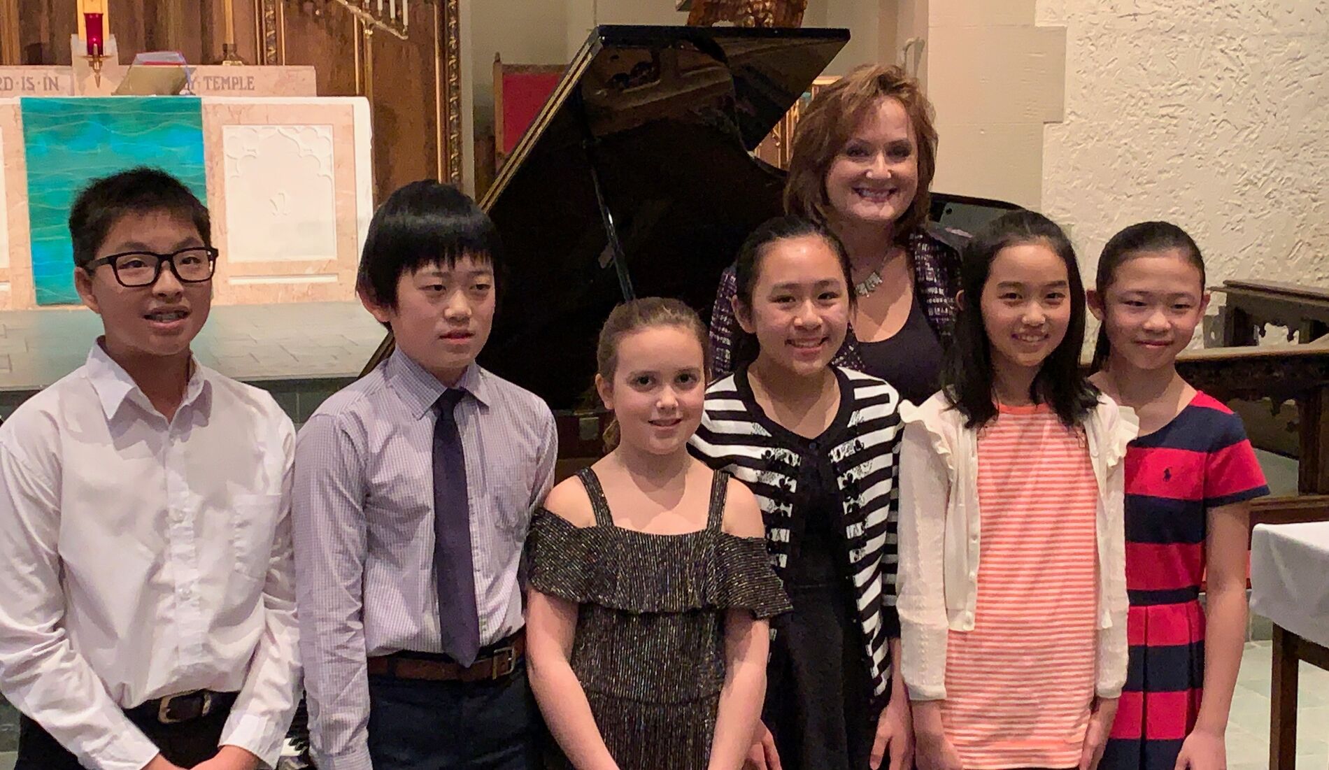 A group of Caruth Piano Studio students together after a studio event